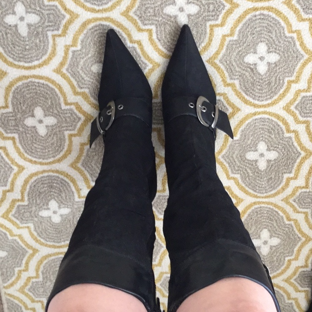 Black, buckled, below the knee, sharp toed boots
